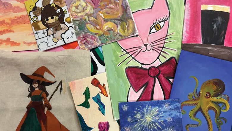A selection of artwork laid out on a flat surface