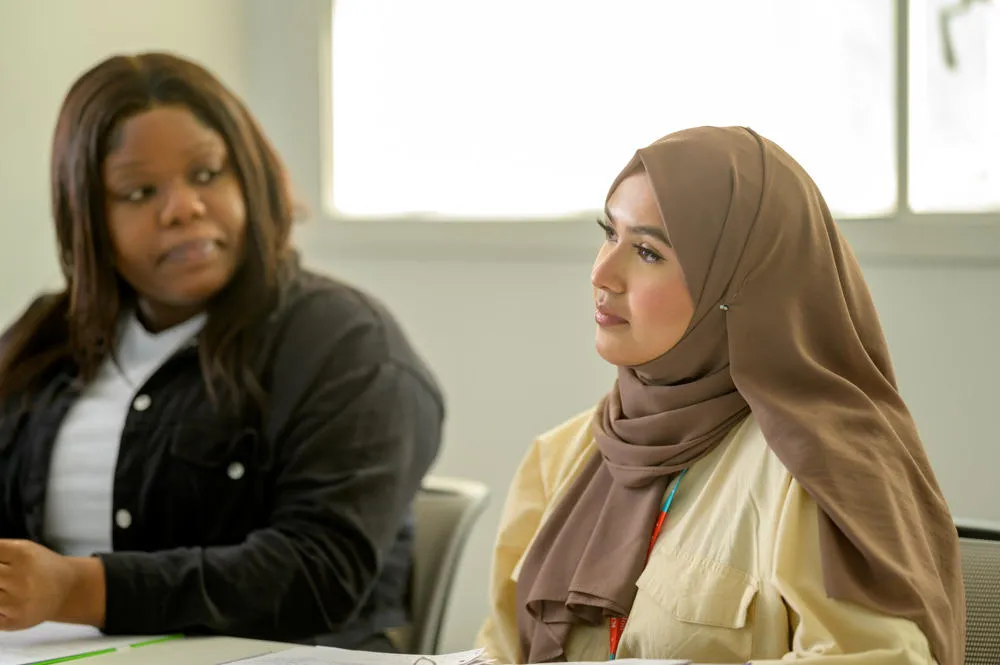 Two King's students sat side by side.