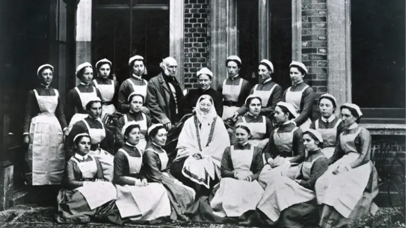 1886 photograph of Florence Nightingale (centre) with a group of nurses from the Nightingale Training School and her brother-in-law Sir Henry Verney