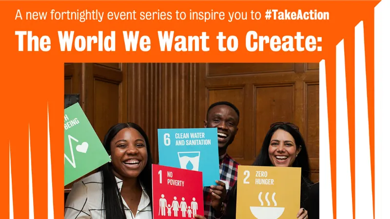 Students smiling at the camera holding coloured cards with sustainability goals