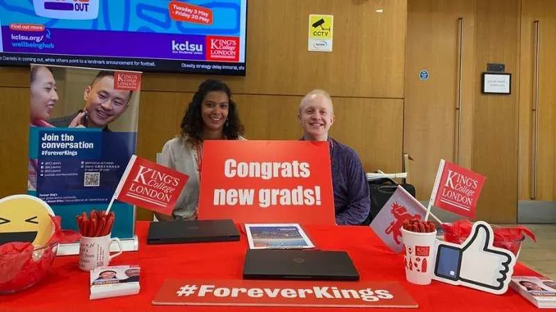 An image of the alumni desk at a graduation ceremony