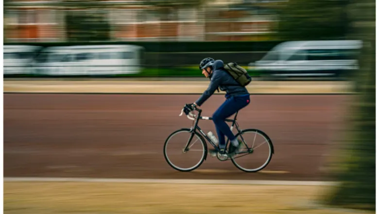 A cyclist on a London road, with the background blurred