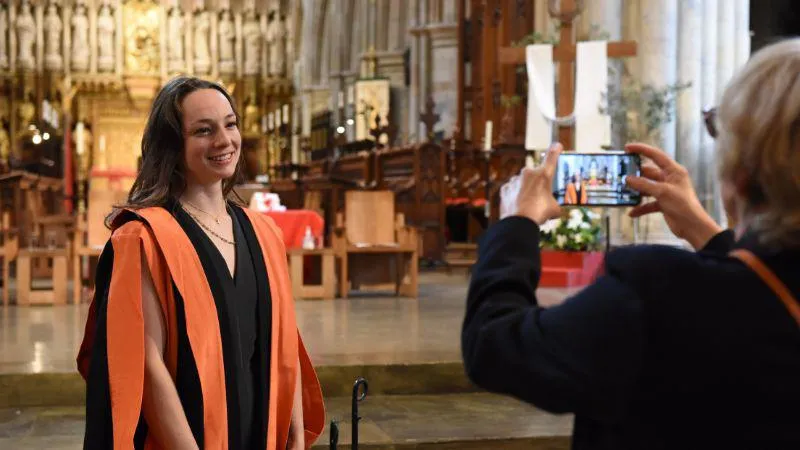 Image of graduate inside Southwark Cathedral