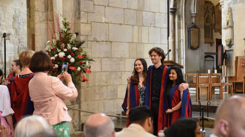 Image of graduates inside Southwark Cathedral
