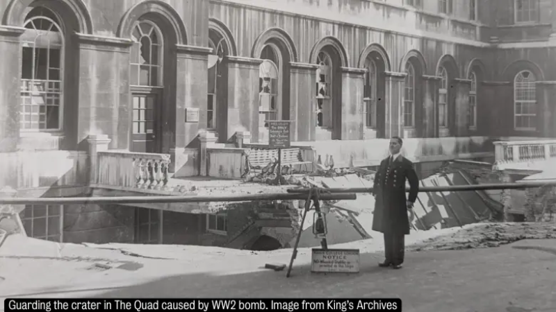 Guarding the crater in the Quad caused by WW2 bomb