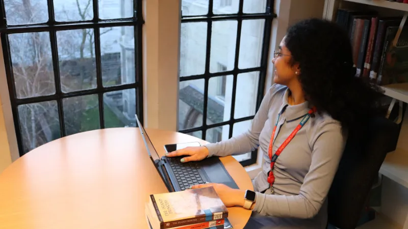 A student looking out of a window