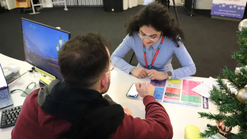 A student talking to a librarian