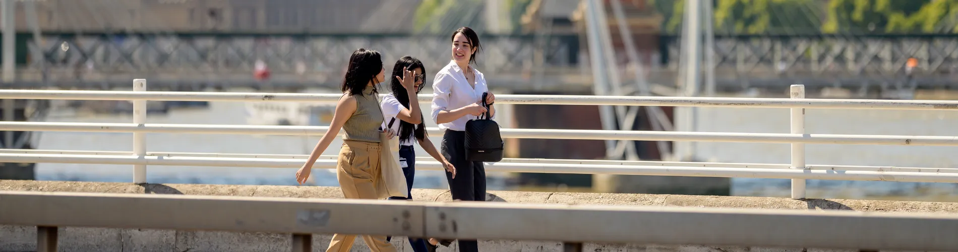 Three students crossing Waterloo Bridge.