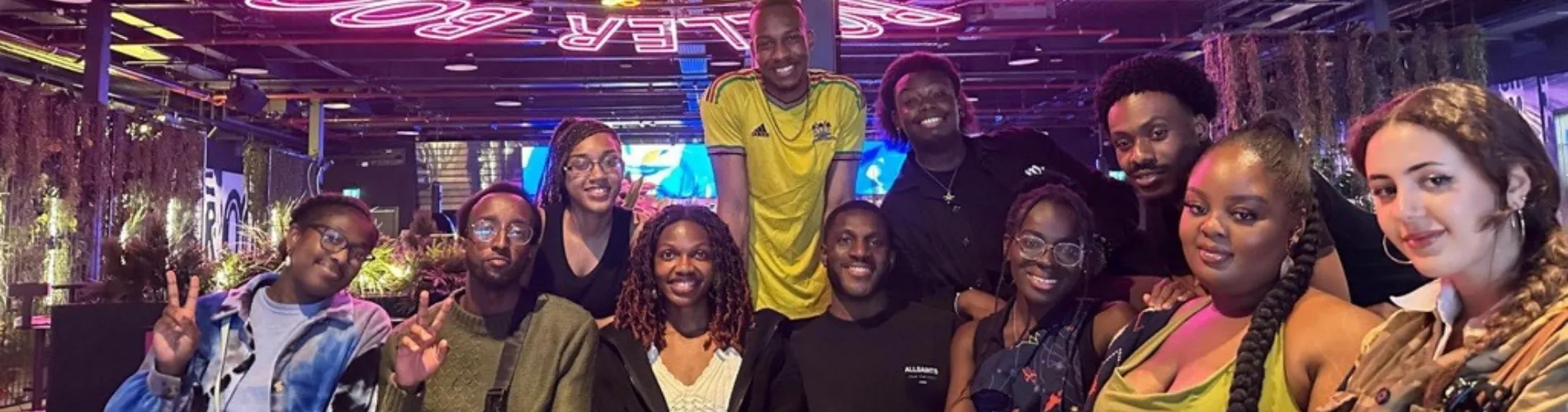 A group of Sapphire's friends smiling and looking at the camera.