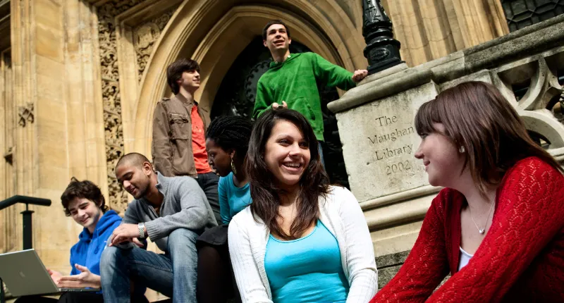 Students sat on Maughan Library steps chatting