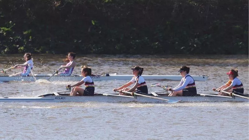 Two rowing teams mid race