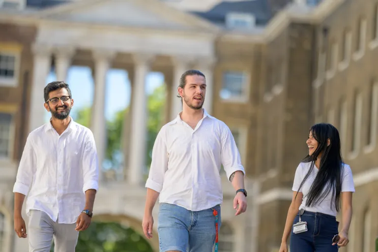 Students at King's College London walking through the campus