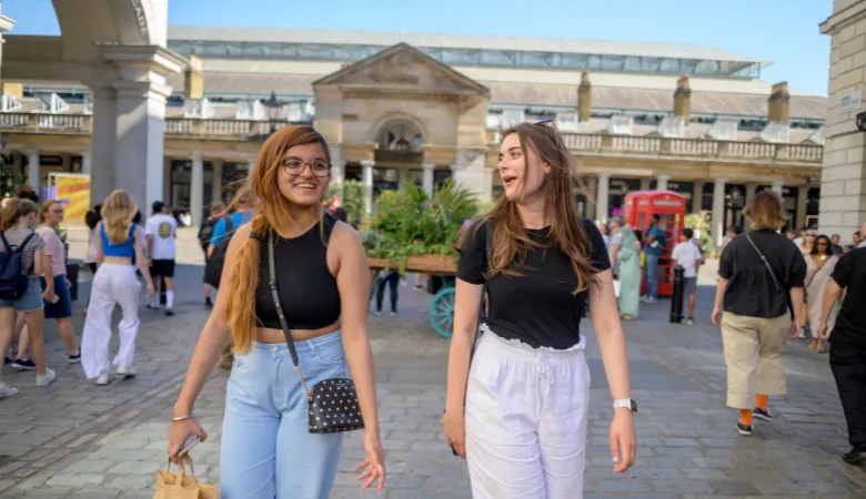 Image of King's students chatting in Covent Garden