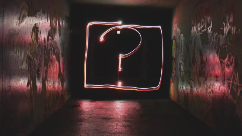 Framed neon question mark in a box 
