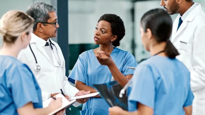 Image of nurses and doctors having conversation