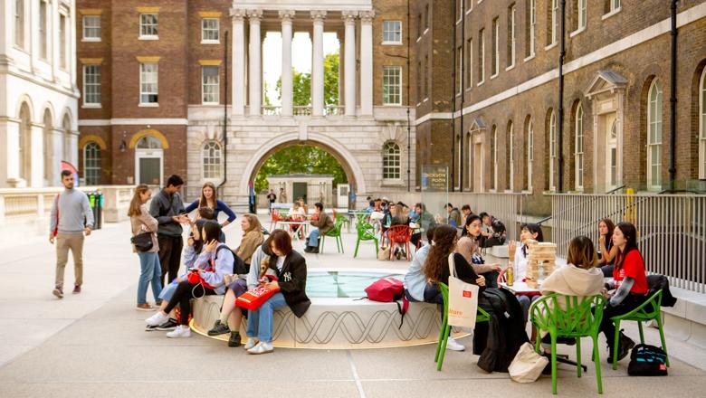 Image of the Strand courtyard with students sitting around.