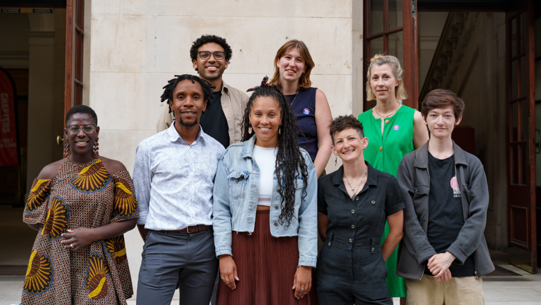 The team from SOS-UK posing and smiling in a courtyard at the RACE Summit July 2025