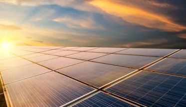Solar panel against the setting sun