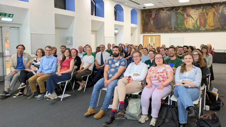 People sitting in the audience at the sustainable research event