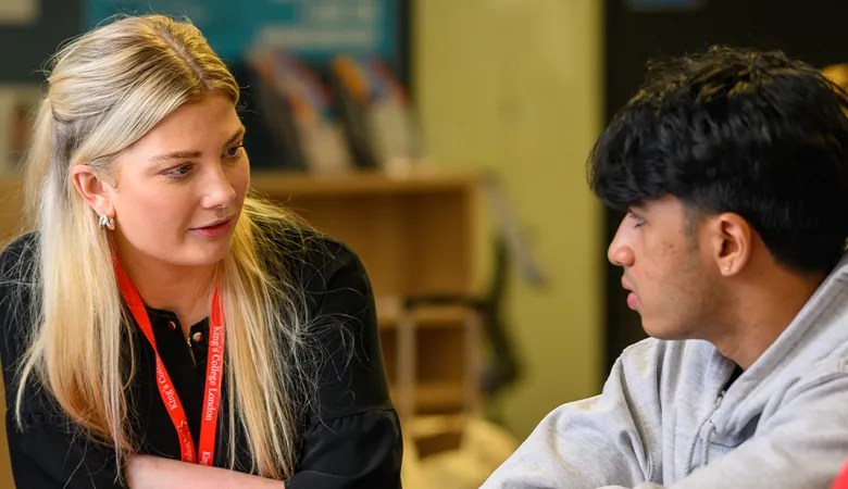 Staff and student in conversation