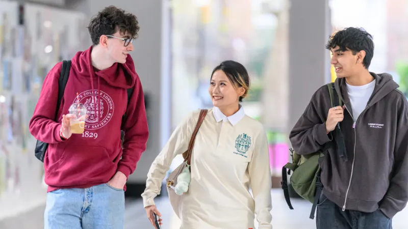 Three students walking together.