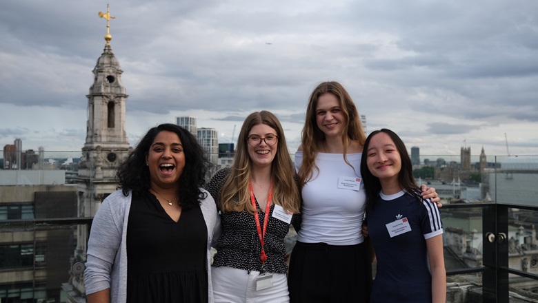 Staff and students involved in King's Volunteering stand together smiling 